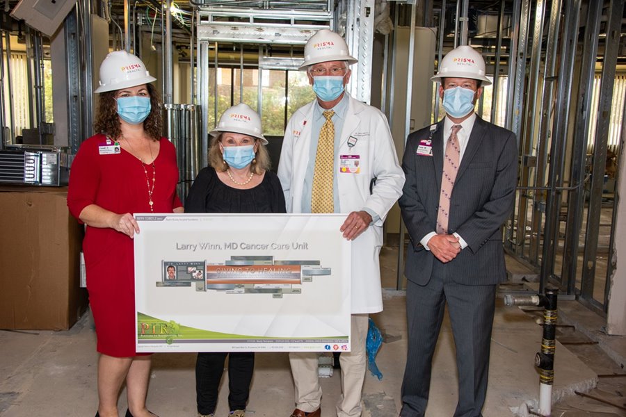Prisma Health representatives pose at new cancer unit.